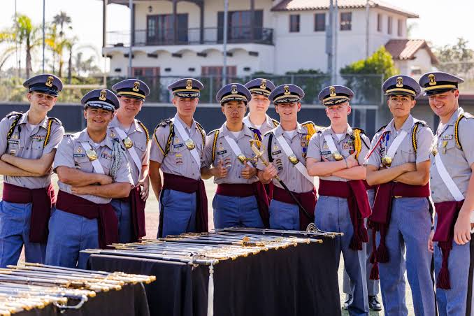 Army and Navy Academy cadets in dress uniform with ceremonial sabers