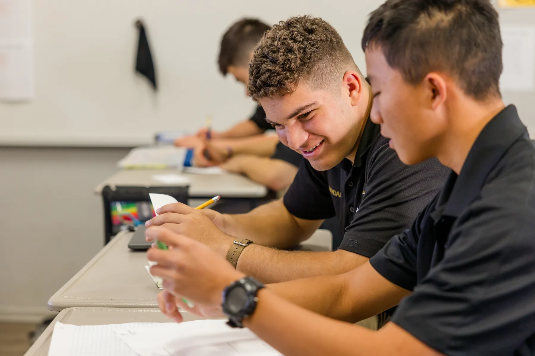 Students working together in an Army and Navy Academy classroom